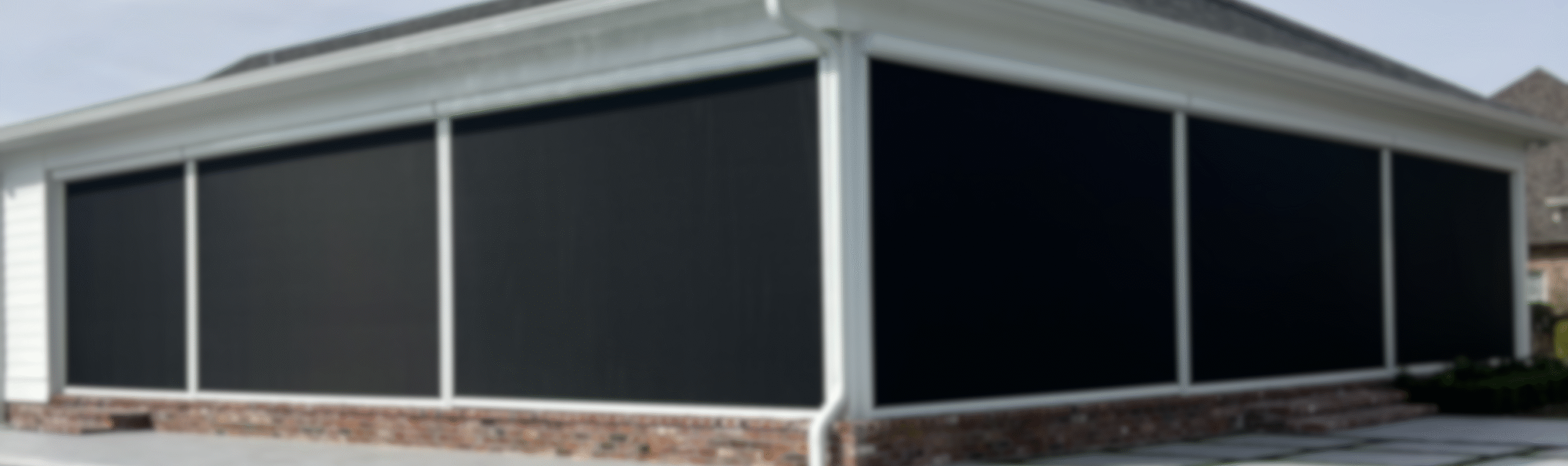 Custom-installed motorized shades by Southern Style Screens for effortless light control and modern outdoor living.