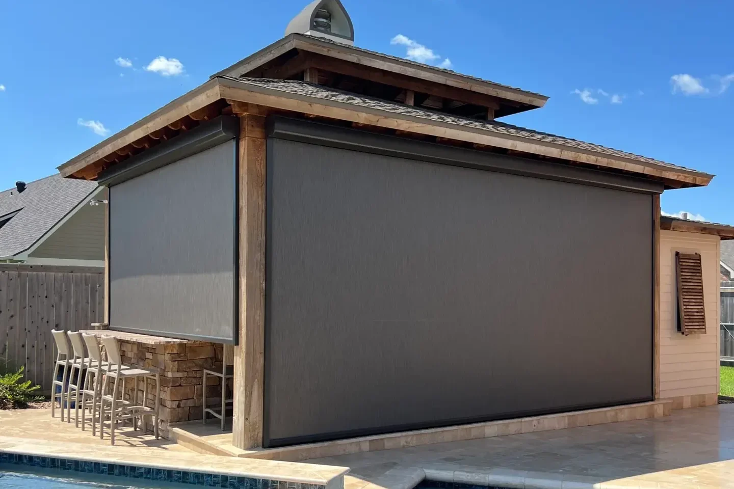 Motorized Screen over bar top by pool