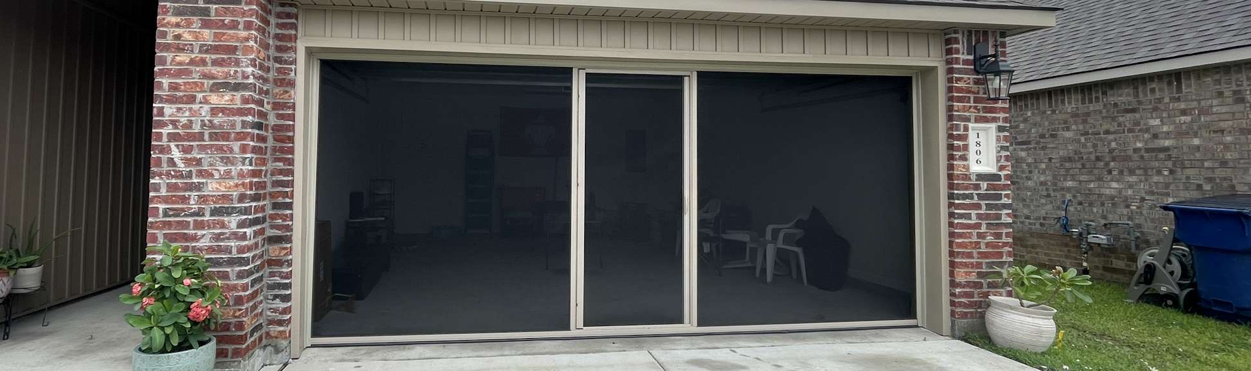 Garage screen door with walk-through access installed in Lafayette, LA.